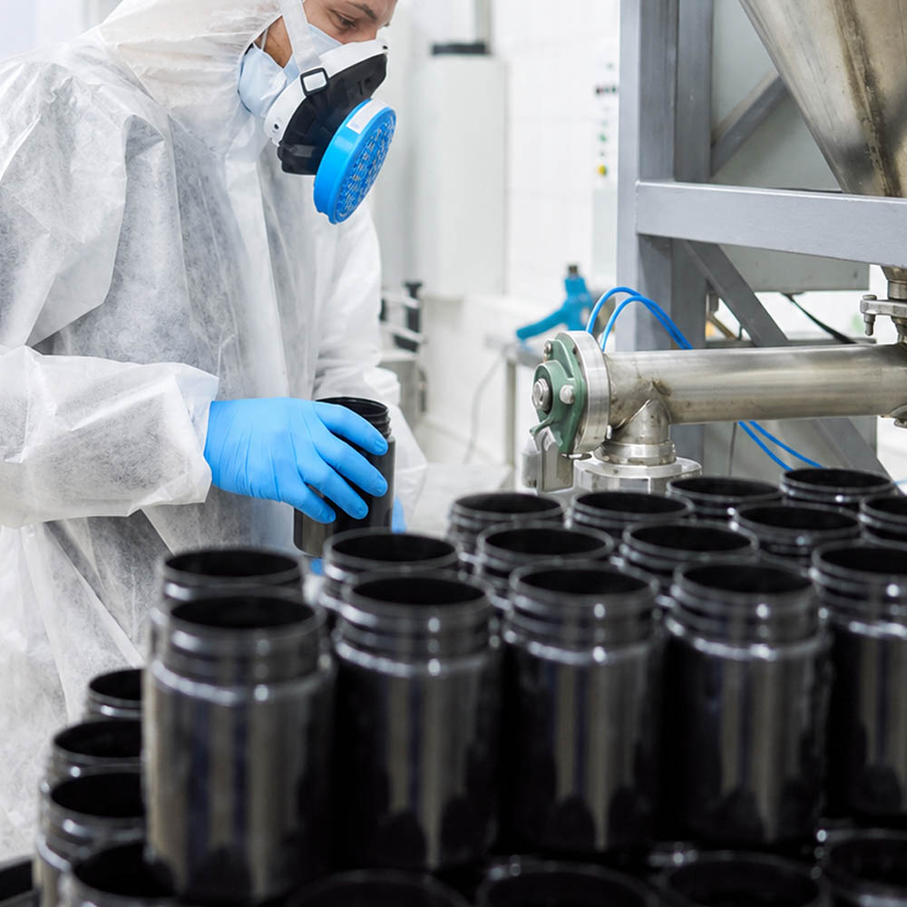 Rows of empty tubs while a man is holding an empty tub